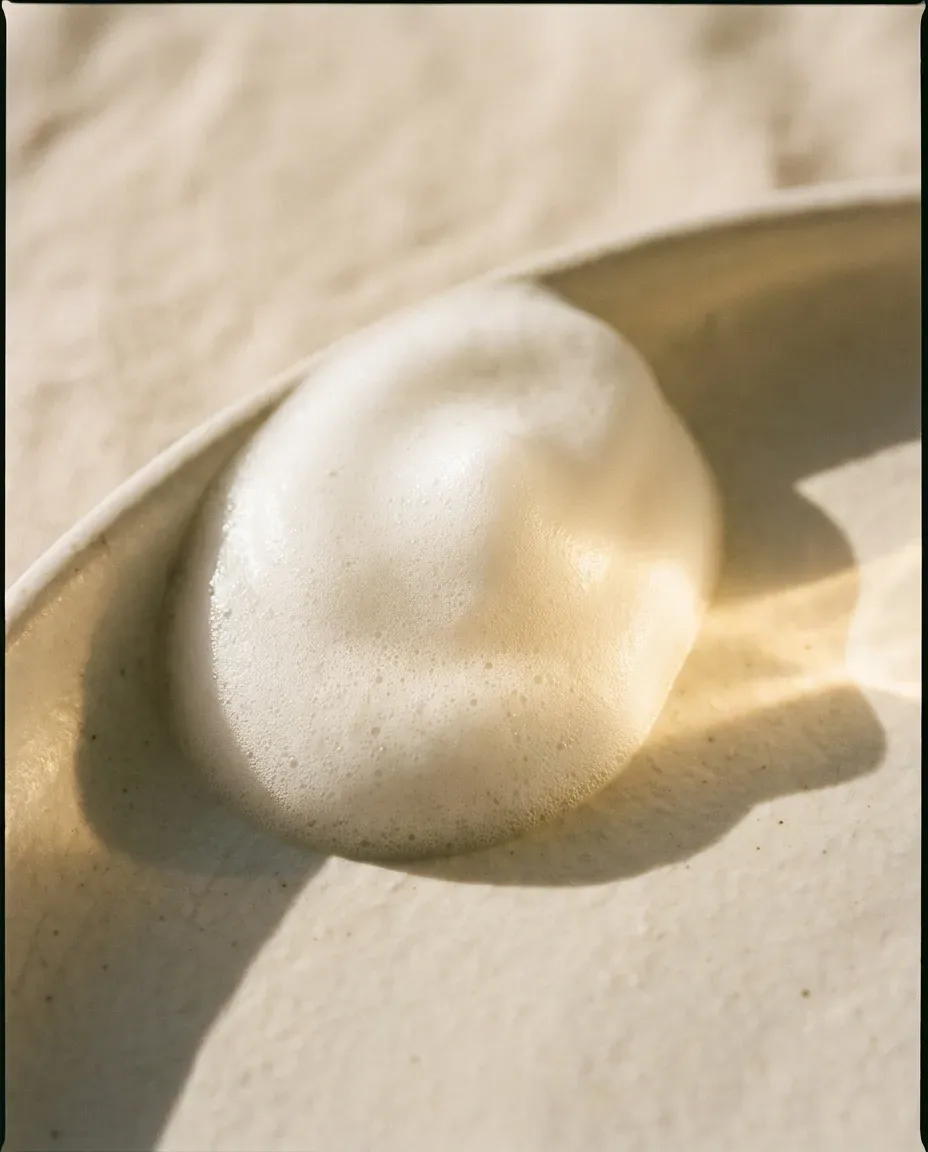 Dome of soft white foam on a ceramic dish