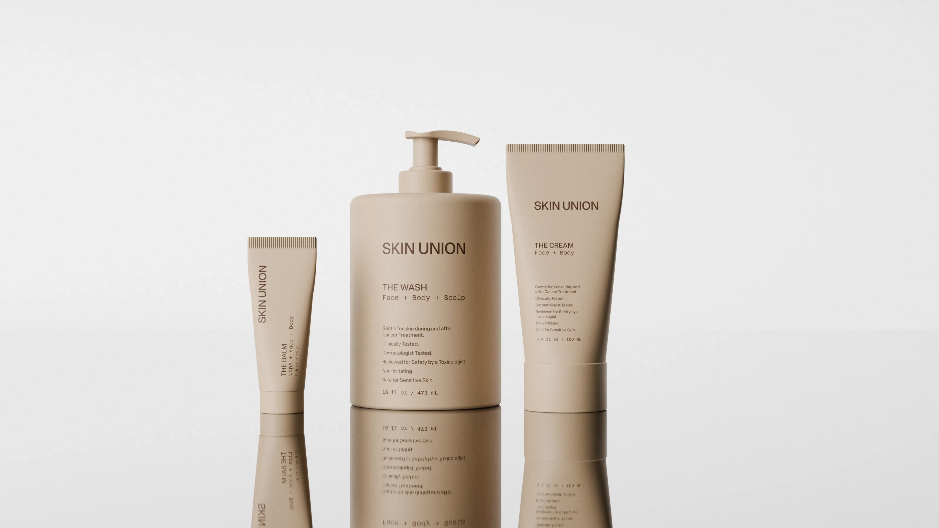 The Balm, The Wash and The Cream standing side by side on a reflective surface